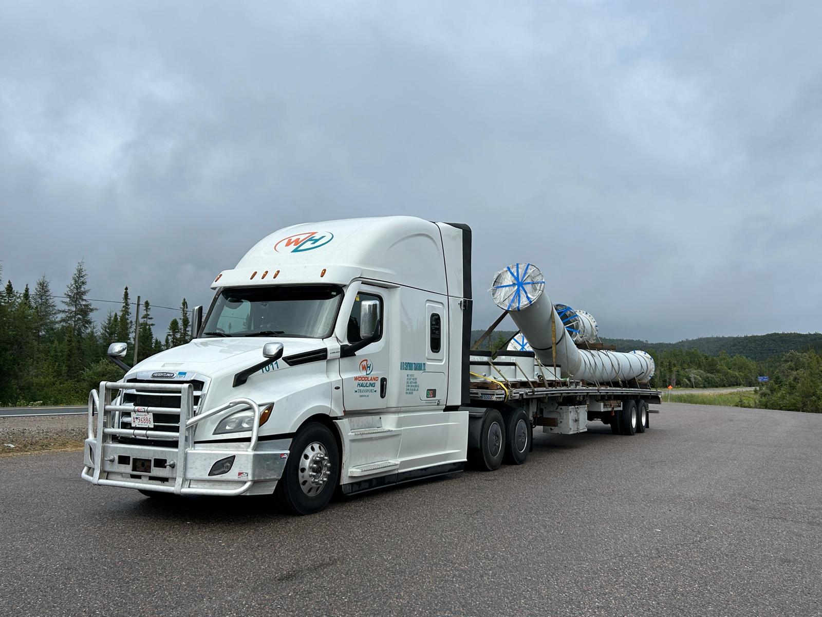 Woodland Hauling Transport truck with company branding